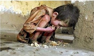Poverty - A child is eating bad foods at the street