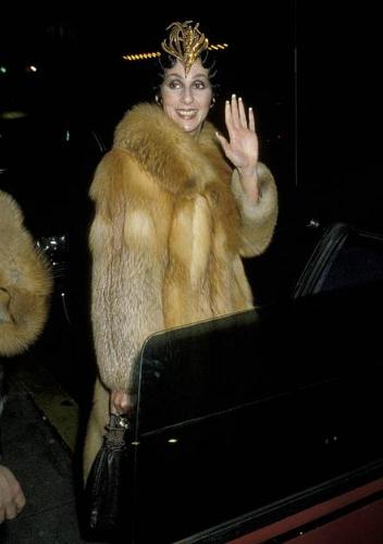 Cher - Cher in a fur coat and crazy head piece! So Cher!