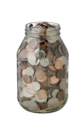Coin jar - Here is a coin jar. It has lots of coins in it.