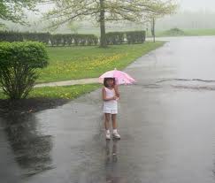 child plays in rain.. - cool rain, enjoying child with umbrella