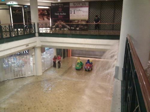 "Waterfall" at Tanglin Mall Flood - Water coming in from the streets, formed a "waterfall" in the basement of the shopping center when sudden downpours created flash floods at the street level.