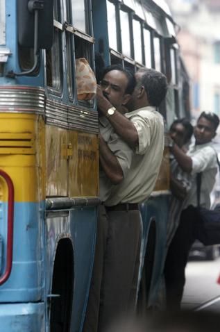 Bus Ride - Overcrowding buses is very common in Asia. This is in India.