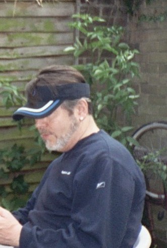 What's with the vizor? - Is this older guy trying to look 'youthful' with that jaunty vizor cap? Grow up is what I say!