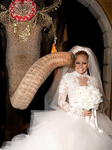 Nicole Richie - Nicole Richie got married last december. Her husband surprised her with an elephant! I don't think Nicole is thrilled the elephant is 'kissing her'!