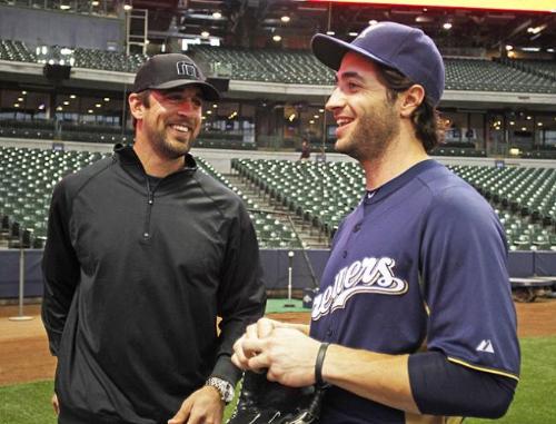 Aaron Rogers and Ryan Braun - Aaron threw out the first pitch at a recent Brewers game. He is good friends with left fielder with the Brewers,Ryan Braun.