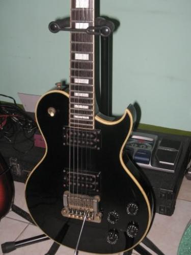 guitar - A black guitar on standing position.