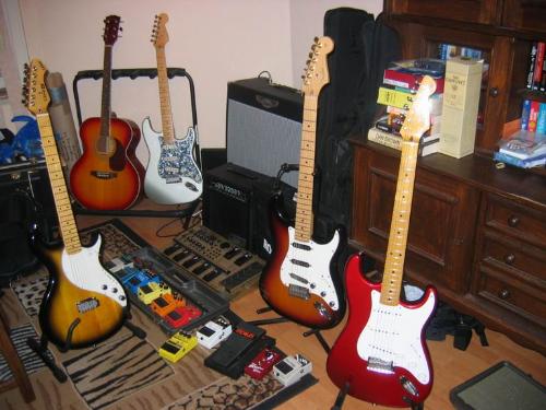 guitars - Multiple guitars in a room.