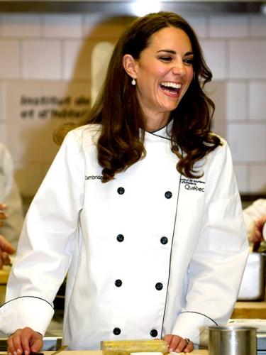 In a chef's jacket - Kate and Williams toured a kitchen and Kate was given a chef's jacket to wear!