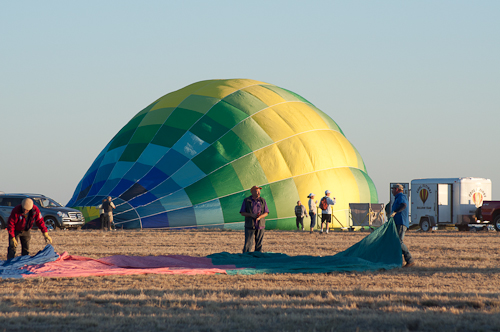 Calypso takes form - The hot air balloon Calypso is inflated by its launch team. Arizona Dawn's envelope is in the foreground.