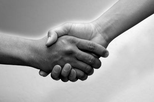 hands - photo of two people shaking hands