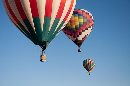 Gemini, Her Highness, and Arizona Dawn - Three hot air balloons in flight