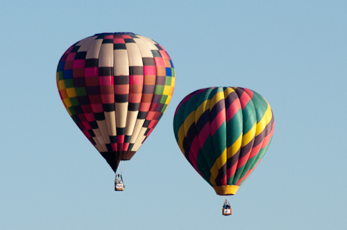 Arizona Dawn and Her Highness - Two hot air balloons in flight.