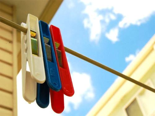 laundry clips - a day for laundry to dry out in the summer bright yellow warm heating sun