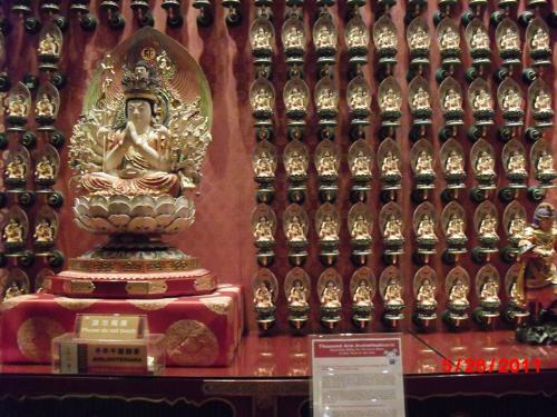 Small Buddha statues - Small Buddha statues adorn the inner wall of the Chinese temple