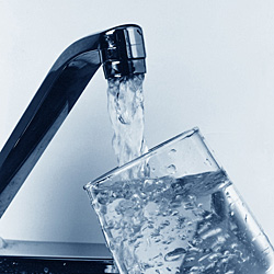 water tap - glass of water being filled from a tap