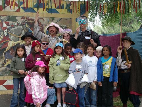 School feild trip to the renaissance faire april 2 - My girls are the ones in pink and blue hats, and the guy with the fairy mask is one of their teachers