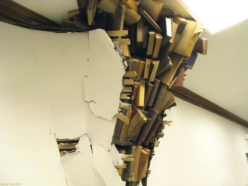 Art? - Seriously? It looks like books are going to crashing through the wall at any moment!They say it is art not what I said it looked like!