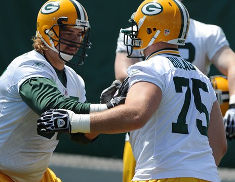 right tackles - Number 65 is no longer with the Pack and I am not happy,still! I miss Mark Tauscher! Bryan Bulaga is now the right tackle and so far he has done good.