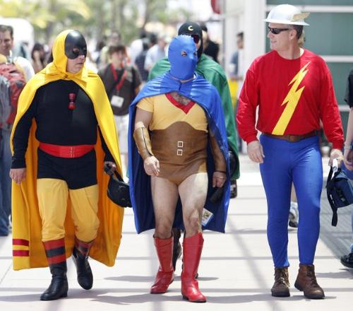 Super Heroes - Three Men dressed as Super Heroes on their way to a Super Hero convention.