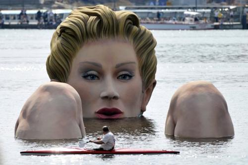 Statue in lake - It is a lake by Hamburg Germany until the 12 of August. People call it the 'Mermaid'.