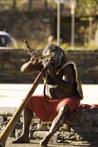 native - a native tribal man resting for he got lost in the streets.