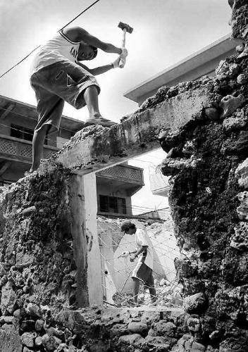hammer - picture of hammer destroying a wall by man