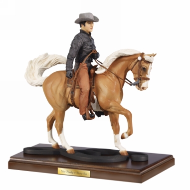 Elvis on his favorite horse - To celebrate Elvis's love for horses,Breyer has a model of Elvis riding his Palomino Rising Star.