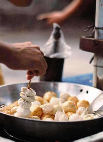 balls - flavored flour balls being cooked as street food in the philippines