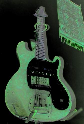 Electric guitars in the green light - Photo Gallery