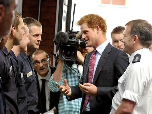 Prince Harry - Prince Harry talking to some people.