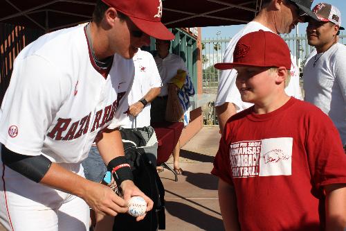 Carson getting autographs - Carson was able to get autographs from the Arkansas players