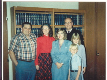 In the Judge's Chambers, the Day We Adopted Our Ch - Jason was 7, and Sarah was 11. My husband is on the left, I'm in red, the social worker is next to me, and the judge is behind us. This marked the end of two years of foster care for these children and made them officially our children. It was a milestone in our parenting adventure.