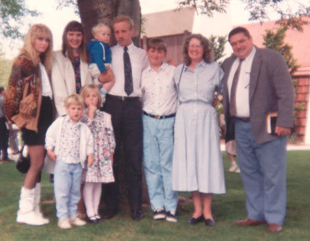 Family Picture on Jason's Baptism Day, April, 1991 - Sarah, on far left, is now 17, and has left us to put herself back into the system. Jason, who succeeded in his fight to stay with us, is now 13, and is third from the right. Kosta and I are next to him on the right, and everyone else are extended birth family of Sarah and Jason who came to see him baptised. In four months, Jason will die in an accident while riding a jet ski.