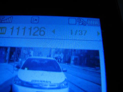 Parking enforcement with a parking ticket. - Very hard to see, I forgot to take my camera to work today.

At the bottom left of the windshield is the parking ticket.