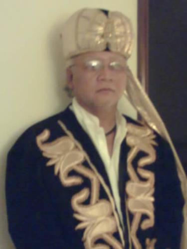 Uzbek Regalia - The Tourman in Uzbek regalia.Notice the fine emboidery.