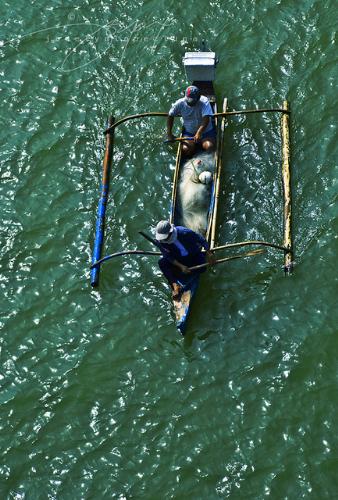 Travel by Sea - Fishermen on small boats used to travel inter-island.