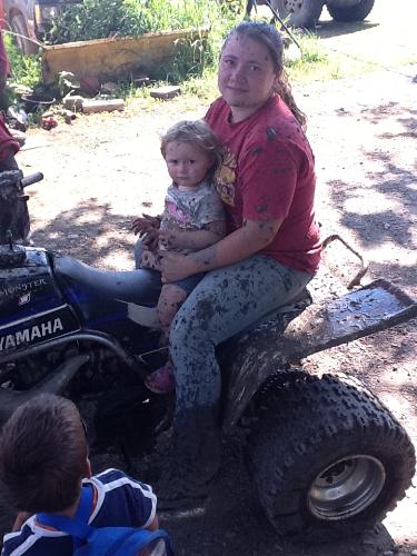 My daughter and I - My daughter and I getting dirty while mudding on the four wheeler
