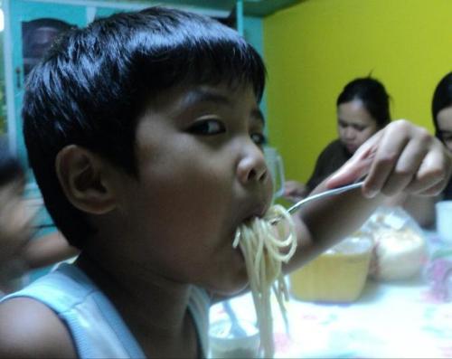 Pasta lover - Enjoying his food a lot!