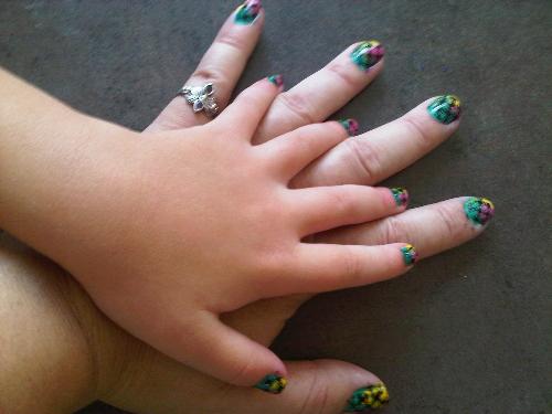 Mother and Daughter nail art - two hands with pretty nail art on the fingers