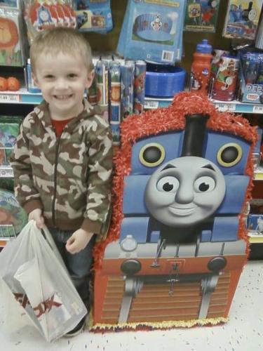 my son and the huge pinata - My son standing next to one of the giant pinatas my son and the huge pinata - My son standing next to one of the giant pinatas