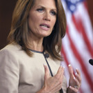 Rep Michele Bachmann of Minn - Rep Michele Bachmann of Minn standing in front of an American Flag