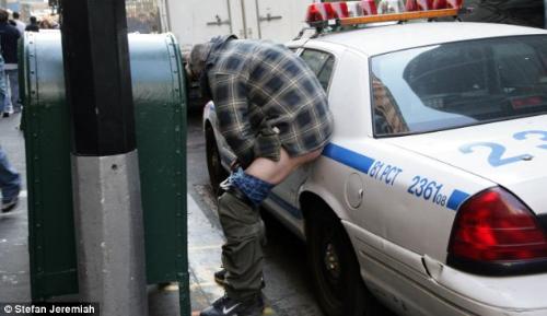 Occupy Wall Street Protesters - Here&#039;s a demonstrator taking a dump on a police car