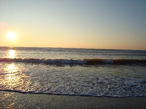 Sunset over the Atlantic Ocean in Atlantic City - A view of the setting sun over the Atlantic Ocean from the beach in Atlantic City, New Jersey