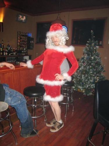 Mrs. Santa Claus ??? - My youngest son dressed as Mrs. Santa Claus one year near Christmas. He worked there in that bar where the photo was taken. His friends all said that, if they had been having a costume contest, he would have won, hands down! LOL