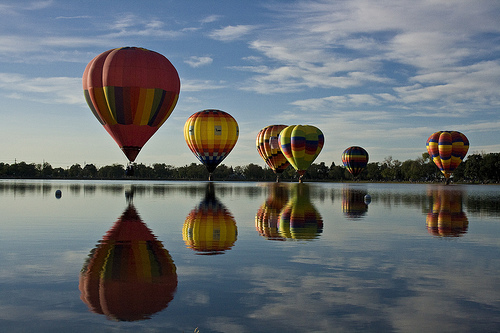 Floating discussions symbolized - These wonderful floating parachutes depict lively discussion topics on the horizon Floating discussions symbolized - These wonderful floating parachutes depict lively discussion topics on the horizon