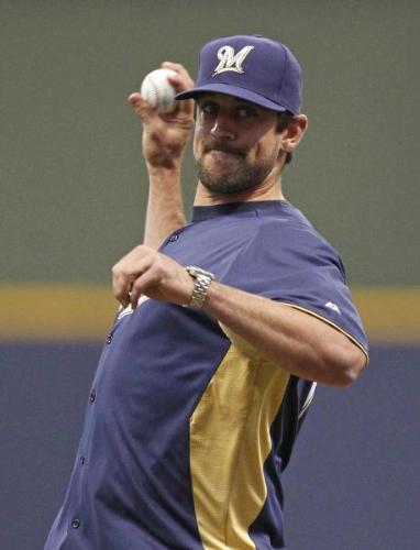 Throwing out the first pitch - Aaron Rodgers did this before a Brewer Game this summer.