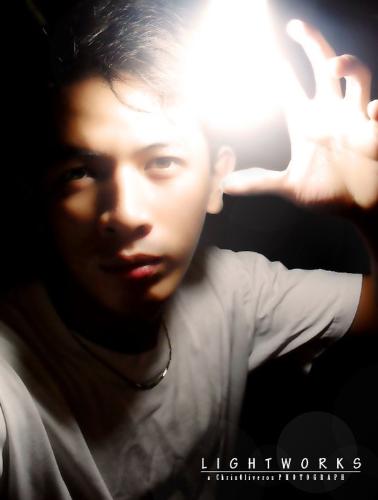The subject is ME. - I took this myself angling through the obliterating radiance of the light bulb beside me.  Took a few tries until I'm satisfied. My Samsung Digital Camera came in handy. I love this shot of myself. They say I look good here. I think so too!