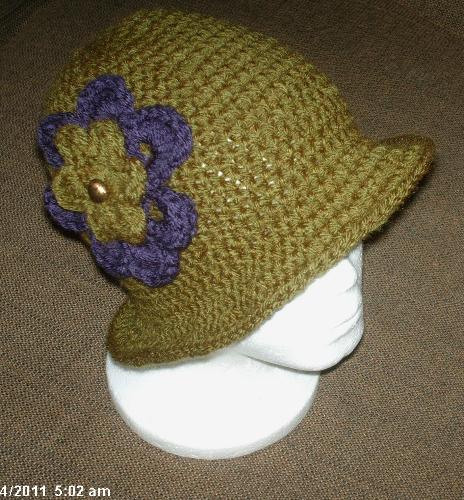 New crochet hat - A customer ask me to make an olive green crochet hat, and I brought two skeins of I think Vanna's yarn. I don't normally use her yarn and was concerned I would not have sufficient so I brought two skeins. I had extra leftover so I made another hat.