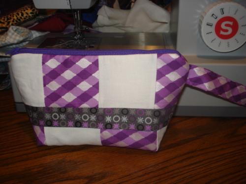 patchwork purple wristlet - patchwork purple wristlet. size is 8X6 inches with a 6 inches handle. all materials are new. 14 dollars free shipping in the US