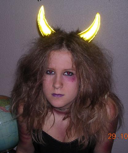 My lovely daughter dressed up for halloween! - Not sure if you can see it but the make up is really very realistic - I create the dead look only with the help of lipstick and eye pencil! The lovely 'dead' girl is my 15-year old daughter Jennie.
